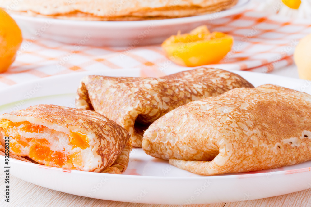 Pancakes with curd cheese and dried apricots