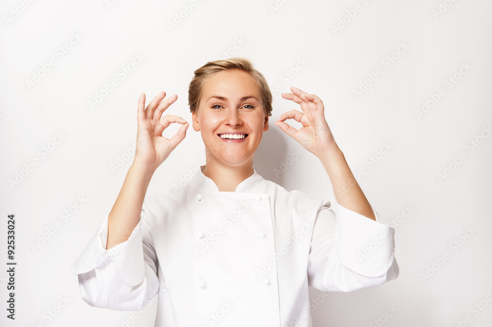 Woman chef showing sign perfect both hands over whita background Woman chef showing sign perfect both hands over whita background
