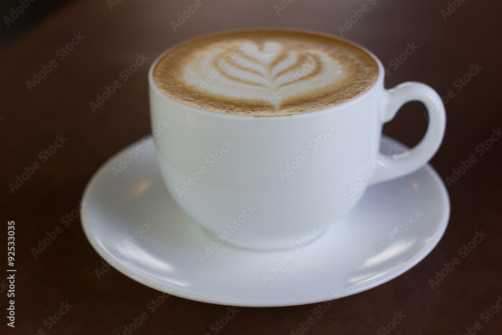 Fototapeta premium Cup of art latte or cappuccino coffee.