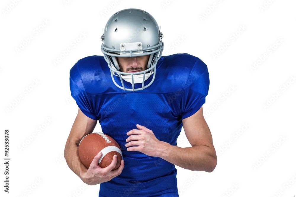 Sports player wearing helmet while holding ball Sports player wearing helmet while holding ball