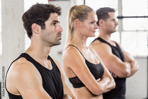 Fit people posing in gym