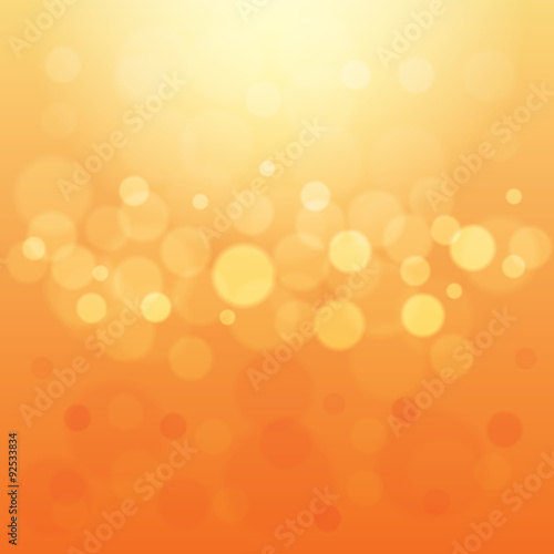 Abstract Light Orange Background with Bokeh Defocused Lights