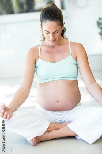Woman meditating yoga with crossed legs Free Download Woman meditating yoga with crossed legs - GFXLoad