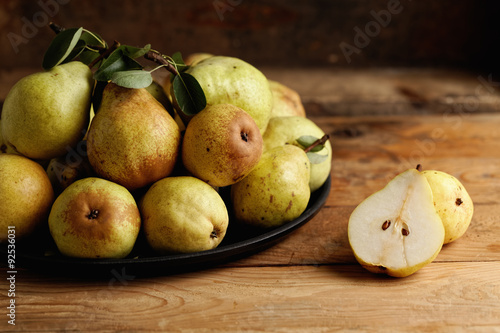 Organic pears on wooden table