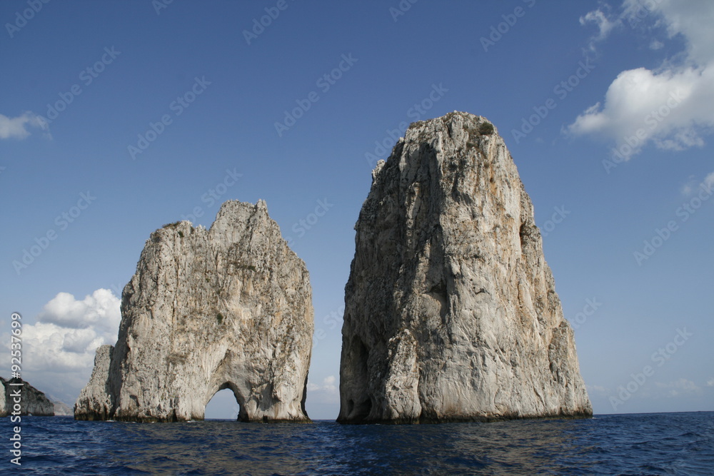 Faraglioni are the three stacks located off the island of Capri in the Bay of Naples.