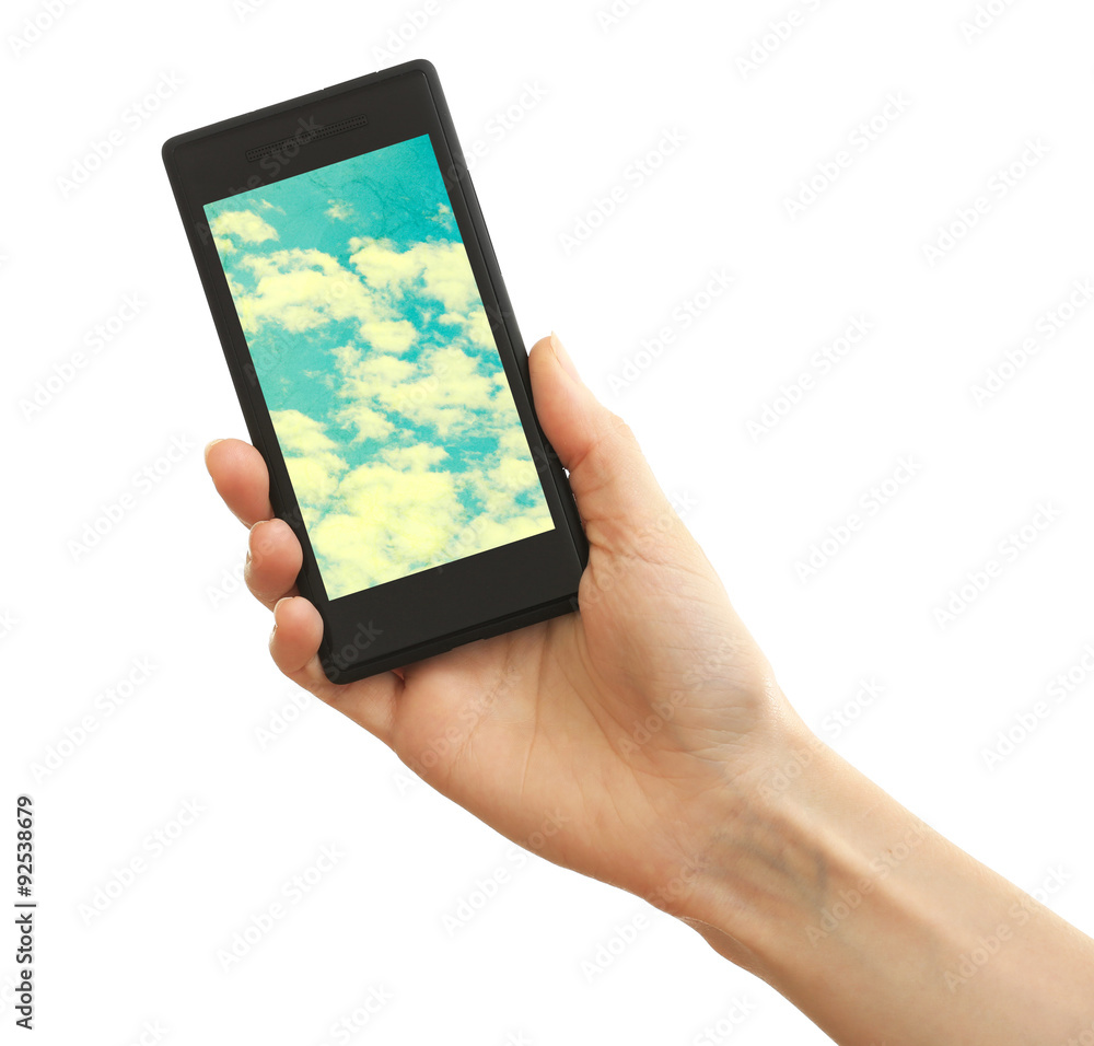 Hand holding mobile smart phone with sky in screen. Cloud computing concept Hand holding mobile smart phone with sky in screen. Cloud computing concept