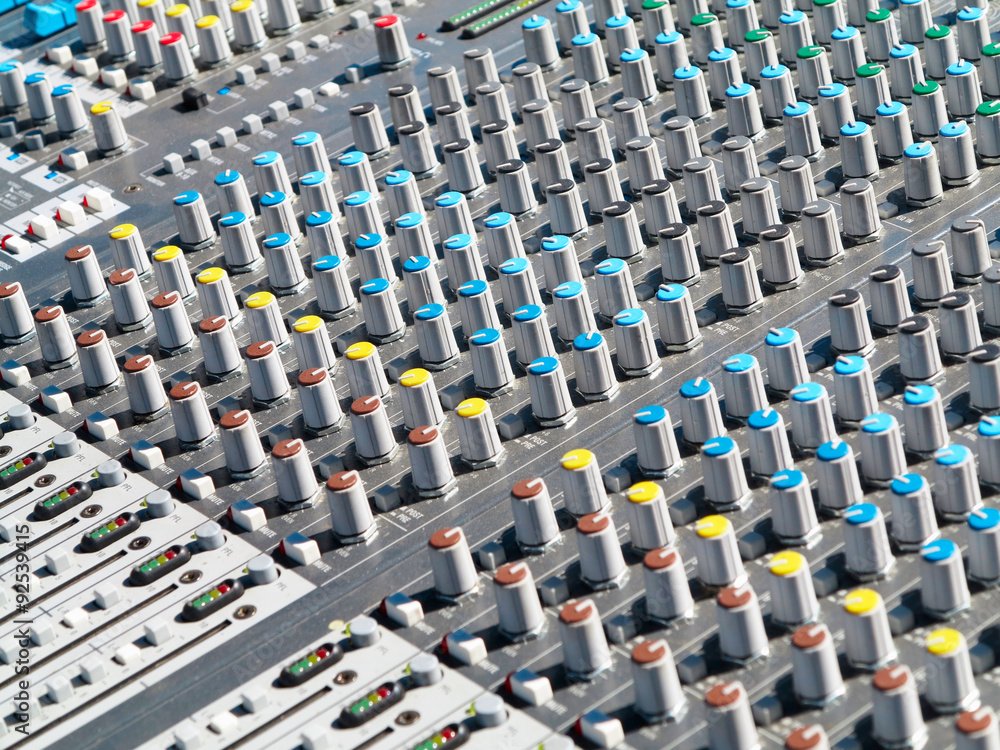 Fototapeta premium Giant audio sound mixer with color buttons and sliders