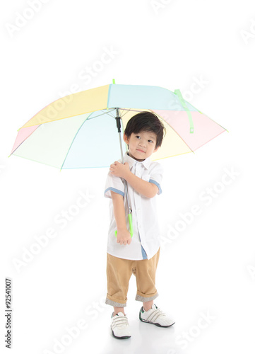 Cute asian boy holding umbrella