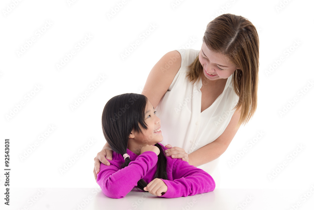 Smiling asian mother and young daughter on white background Smiling asian mother and young daughter on white background