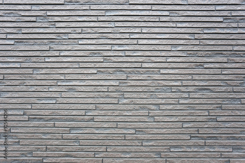 Grey granite stone wall texture.