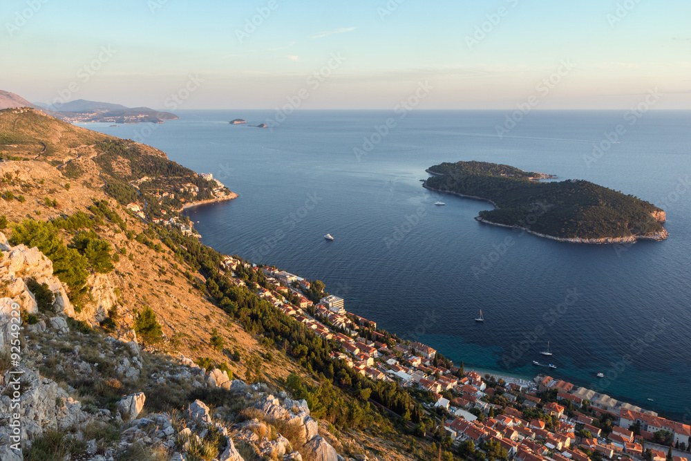 Scenic view of coastline and Lokrum Island from the Mount Srd in Dubrovnik, Croatia at sunset.