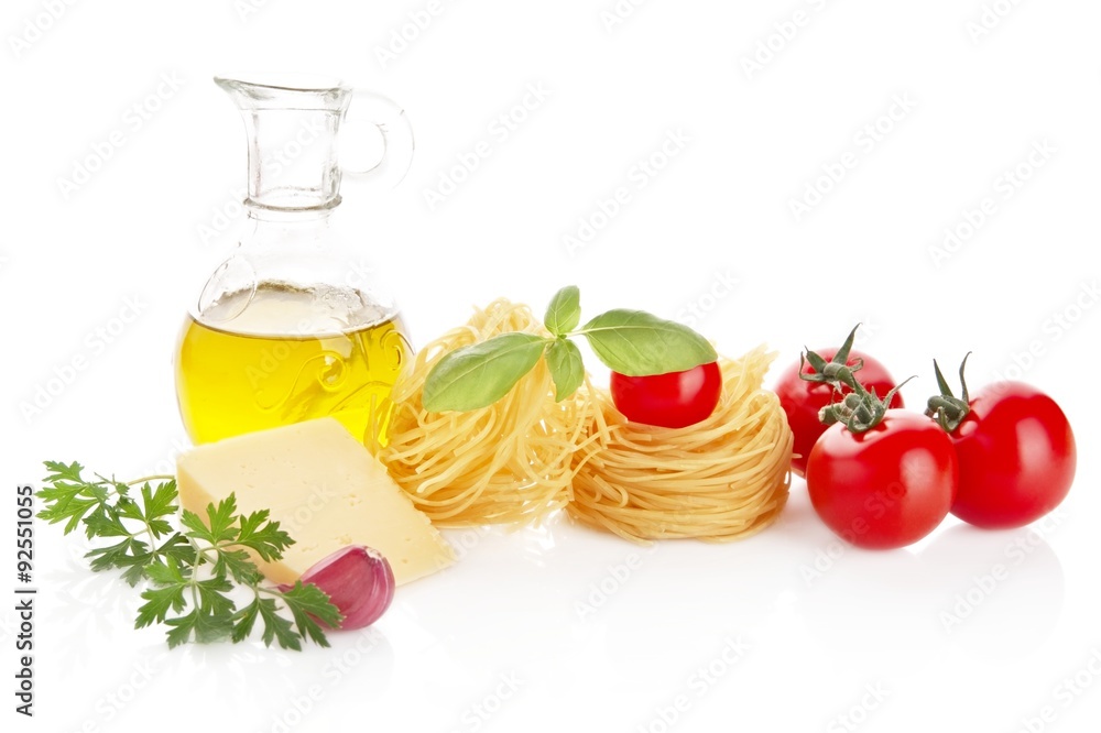 Studio shot of tomatoes,pasta,basil and cheese on white Studio shot of tomatoes,pasta,basil and cheese on white