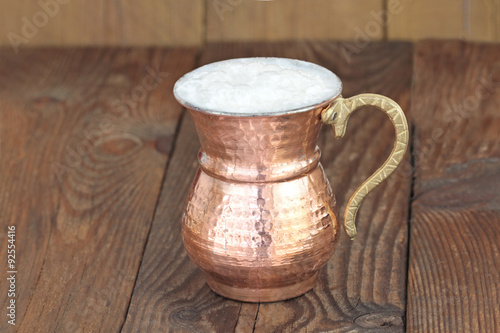 Ayran - Traditional Turkish yoghurt drink in a copper metal cup © Hayati Kayhan