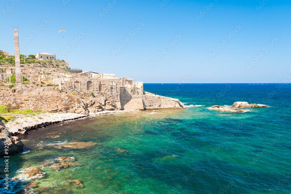 Coastline of Portopalo, in southern Sicily, with the ruins of an old factory for the manufacturing of tuna fish