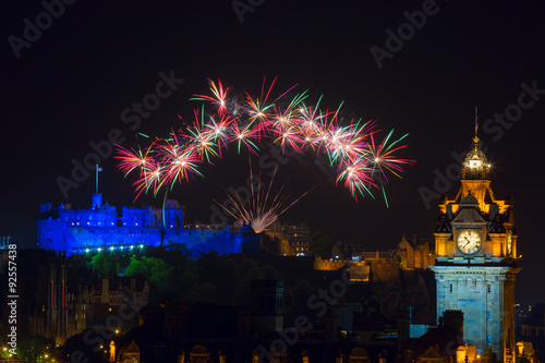 Edinburgh with fireworks over the castle and Balmoral clock tower