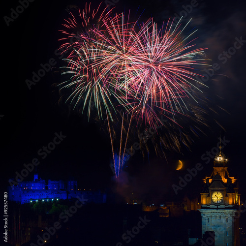 Edinburgh with fireworks over the castle and Balmoral clock tower