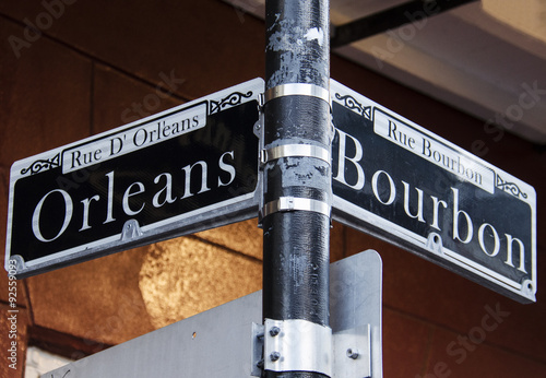 Street signs for Rue D' Orleans and Rue Bourbon in New Orleans, Louisiana photo