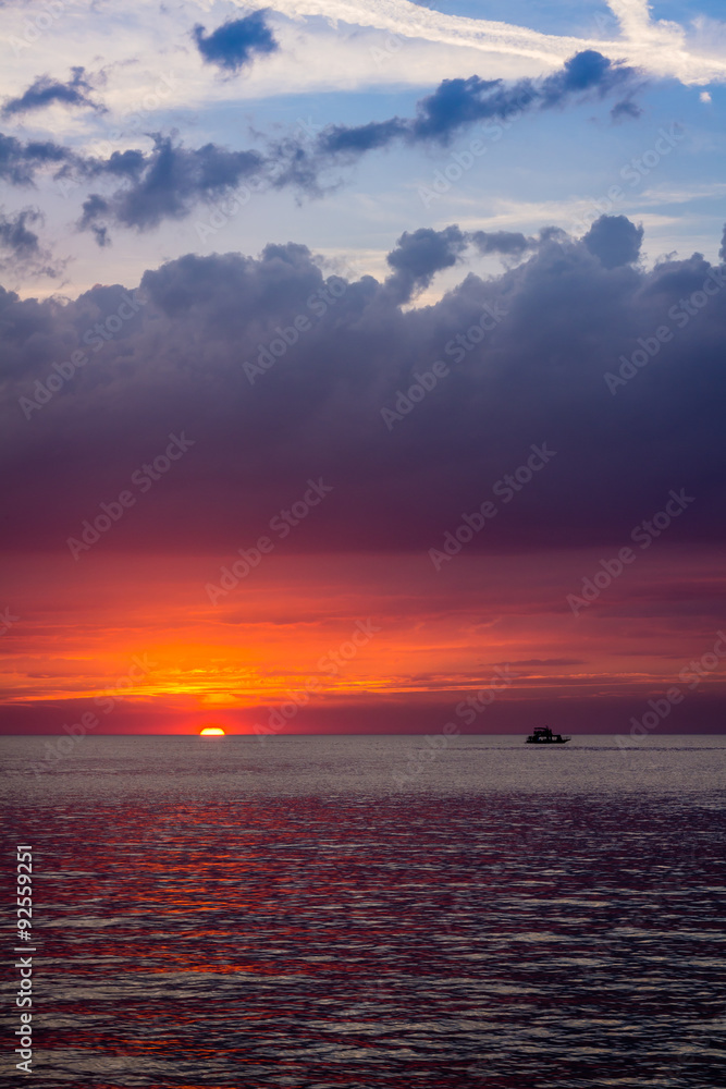 beautiful landscape with sunset over sea with dramatic sky