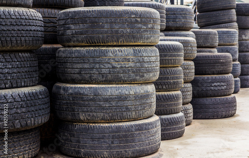 Old used tires stacked with high piles