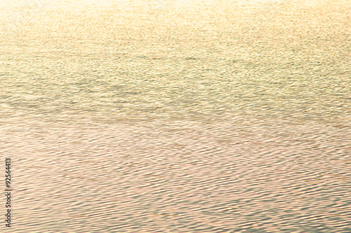 Sun flare on water background - vintage filter