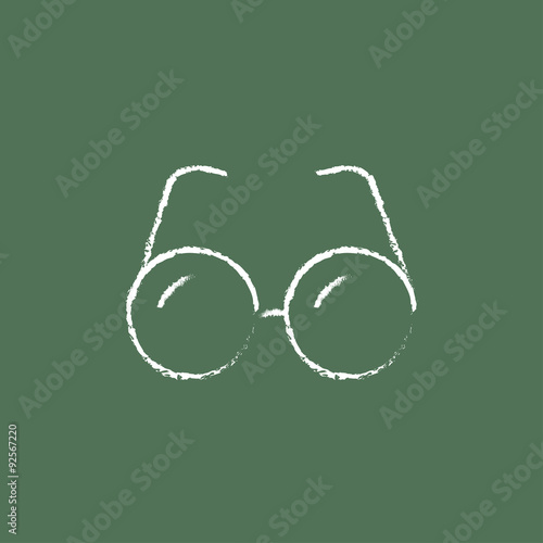 Eyeglasses icon drawn in chalk.