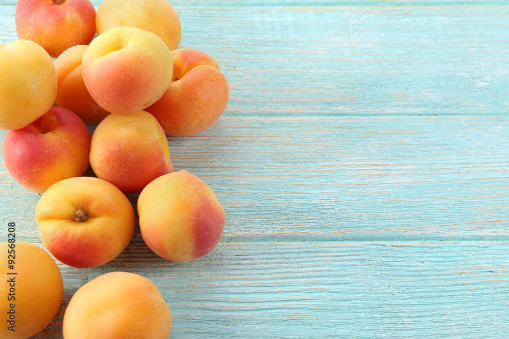 Ripe apricots on wooden table close up Ripe apricots on wooden table close up