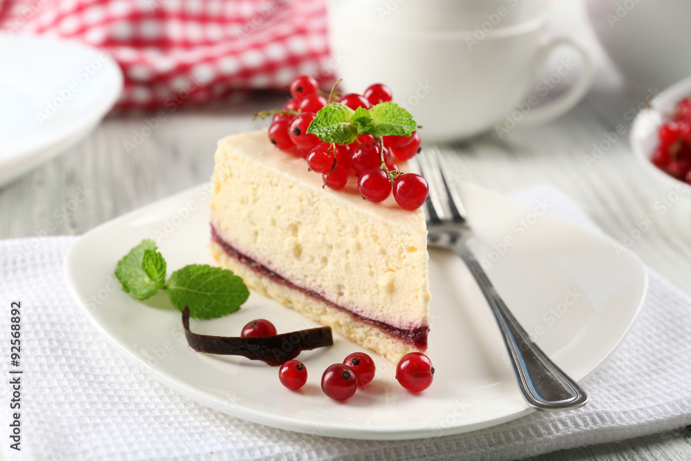 Delicious cheesecake with berries on table close up Delicious cheesecake with berries on table close up