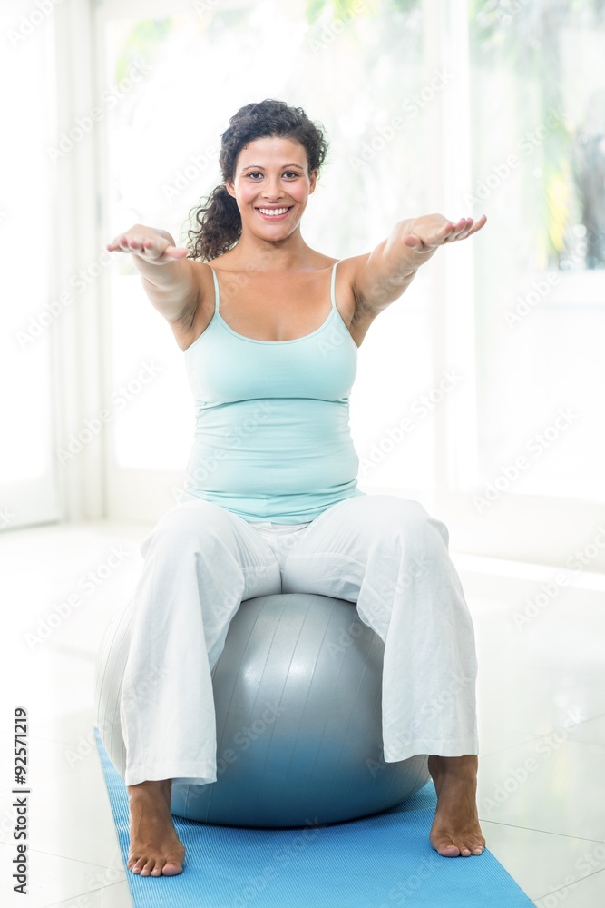 Pregnant woman exercising with ball Pregnant woman exercising with ball