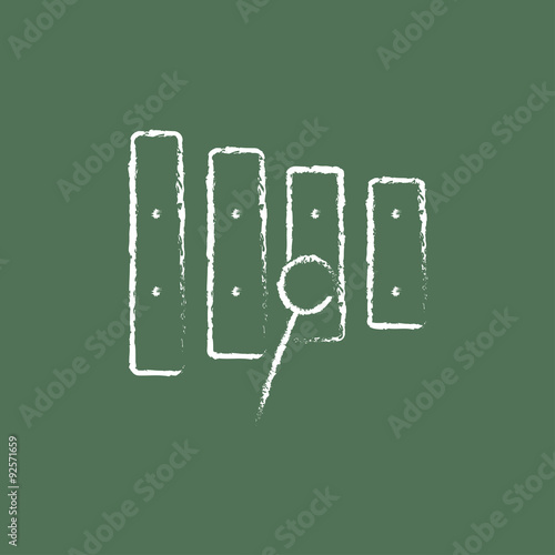 Xylophone with mallet icon drawn in chalk.