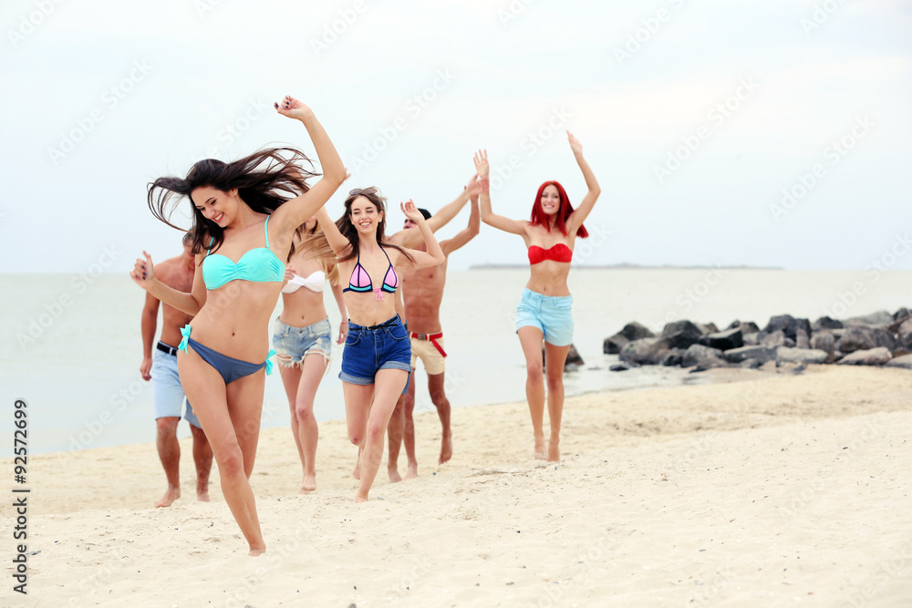 Beautiful young people having fun on beach Beautiful young people having fun on beach