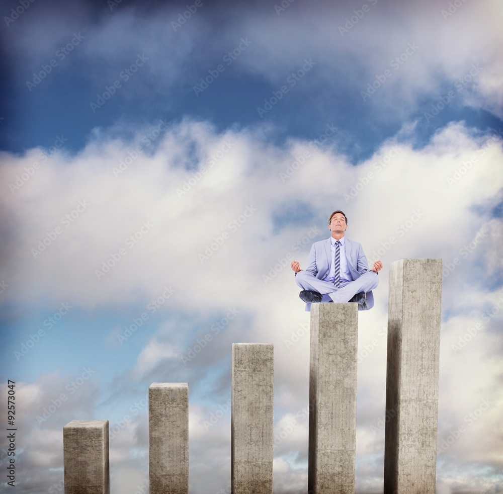 Composite image of calm businessman meditating in lotus pose Composite image of calm businessman meditating in lotus pose