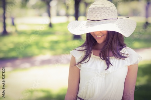 Smiling young woman in sun hat