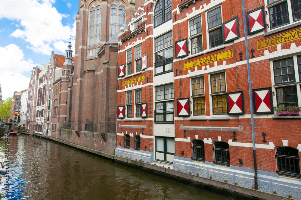 Amsterdam-April 27: St. Nicolas church back-side as seen from canal on April 27,2015 in Amsterdam, the Netherlands. Amsterdam-April 27: St. Nicolas church back-side as seen from canal on April 27,2015 in Amsterdam, the Netherlands.