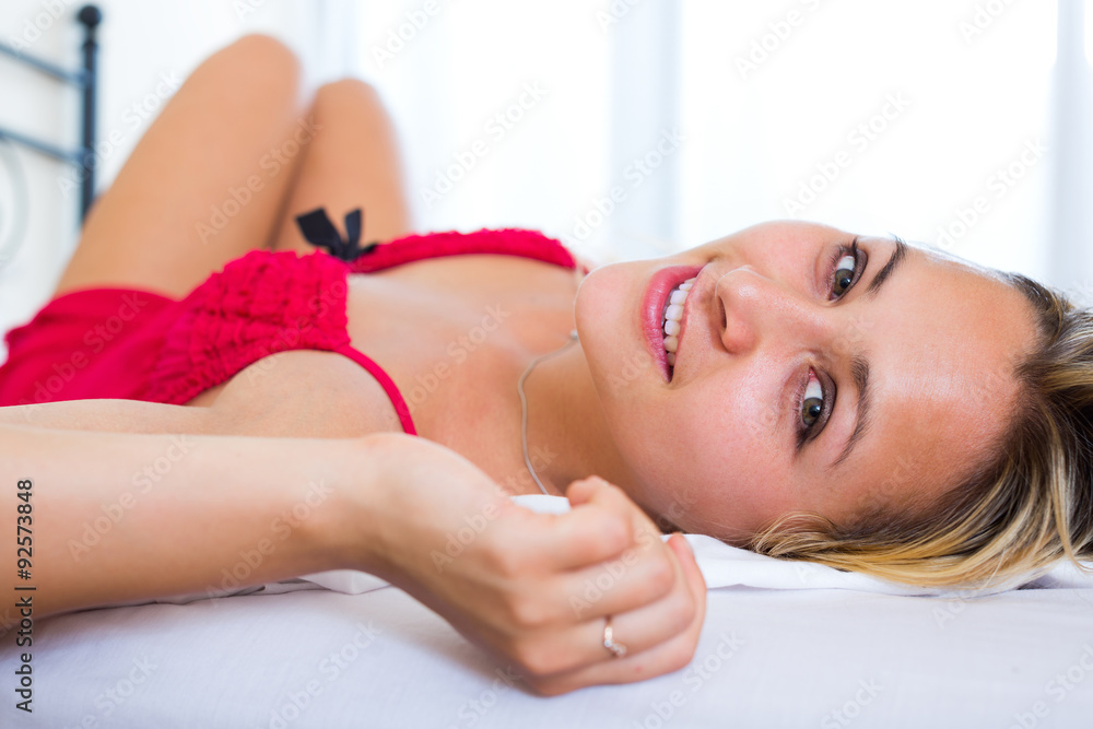 Obraz premium Young sensual woman in bedroom.