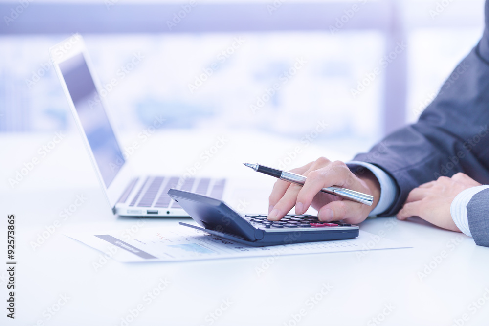 Businessman analyzing investment charts with laptop. Accounting Businessman analyzing investment charts with laptop. Accounting