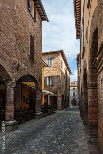 Narrow street with cobbles in the small medieval town of Urbania  Marche region  Italy 