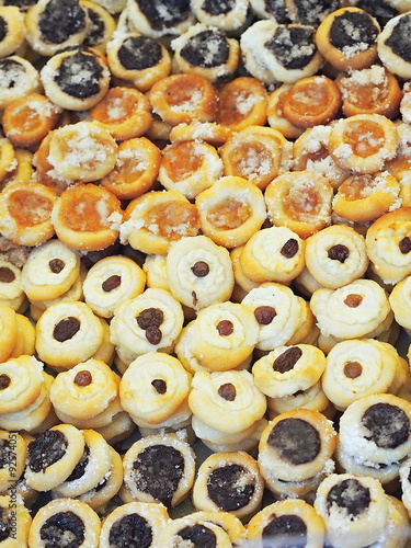 Pile of tiny round traditional czech cakes (kolache).