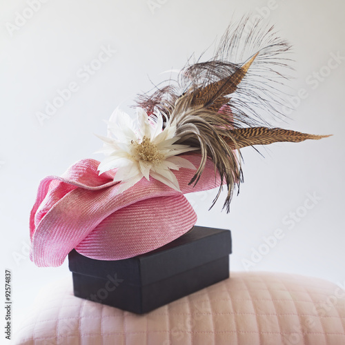 Pink fashion races hat with flower and feathers