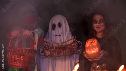 Children In Halloween Costumes Playing Trick Or Treat