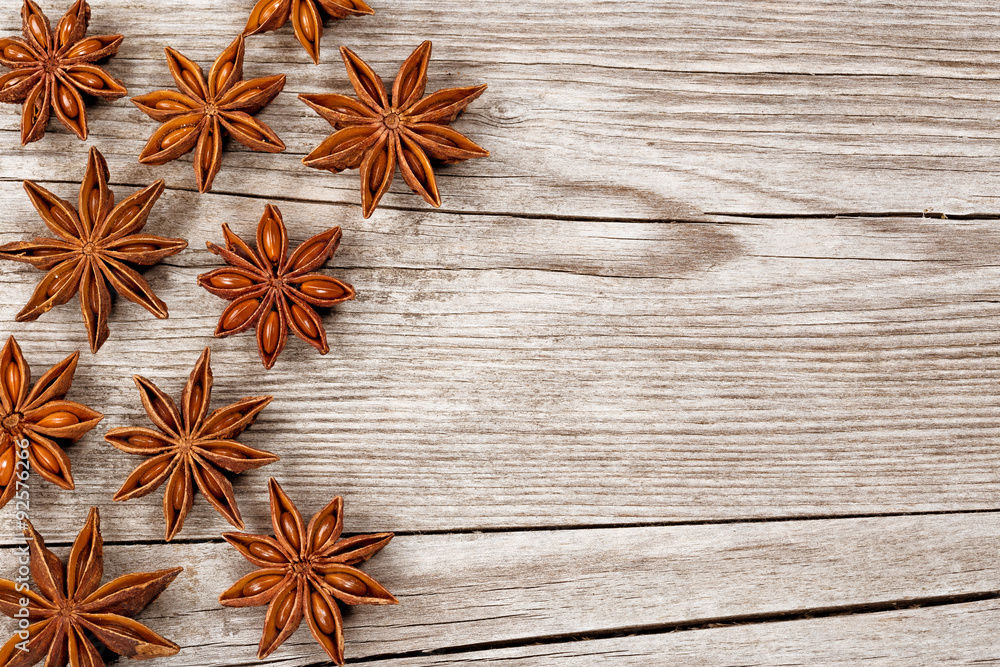 Fototapeta premium group of star anise over wooden table