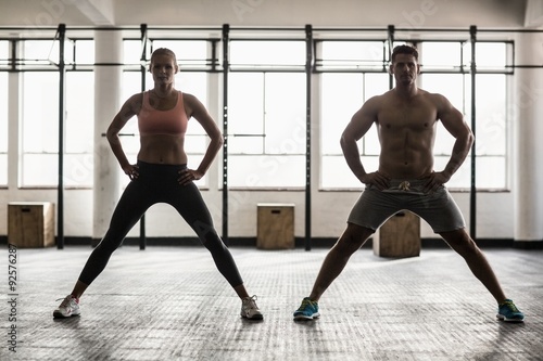 Two fit people doing fitness