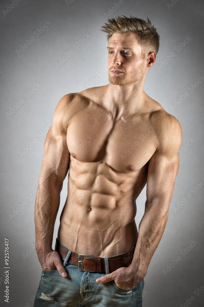 Fototapeta premium Athlete in denim trousers