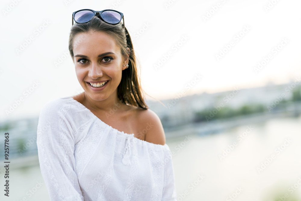 Portrait of a beautiful young woman posing outdoors Portrait of a beautiful young woman posing outdoors