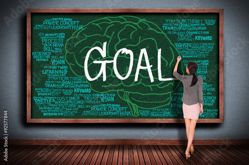 drawing goal with business word on chalkboard photo