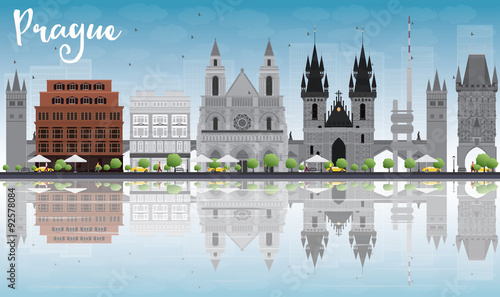 Prague skyline with grey landmarks, blue sky and reflections