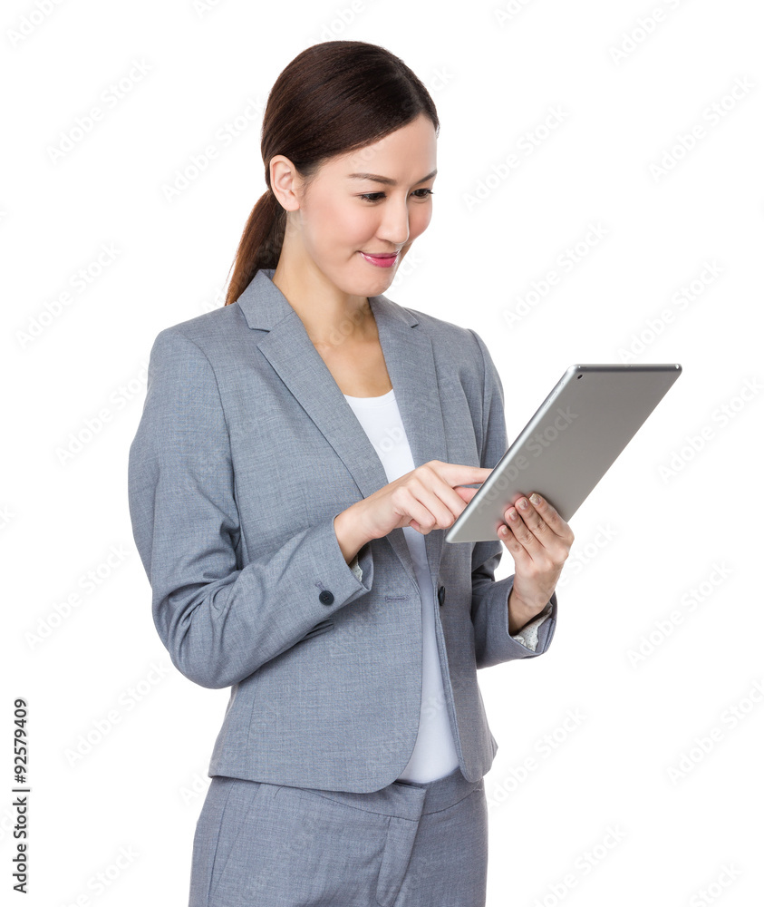 Businesswoman use of the tablet pc Businesswoman use of the tablet pc