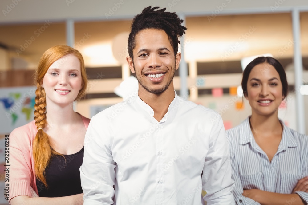 Portrait of confident smiling businessman with female colleagues Portrait of confident smiling businessman with female colleagues