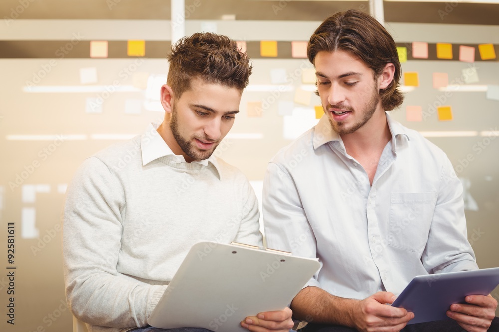 Obraz premium Businessmen with digital tablet and document