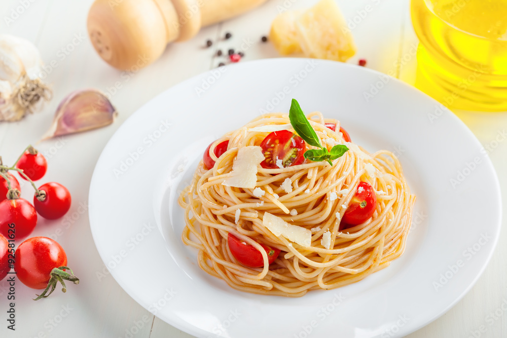 Pasta in tomato sauce with parmesan cheese and basil Pasta in tomato sauce with parmesan cheese and basil