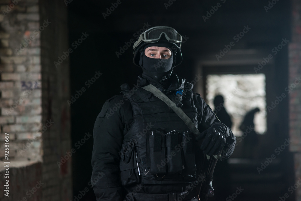 Fully equipped military men with automatic weapons playing Fully equipped military men with automatic weapons playing